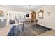 Dining room showcasing hardwood floors, transitional light fixture, and seamless access to the living room at 743 43Rd Ne Ave, St Petersburg, FL 33703