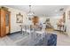 Elegant dining room with hardwood floors, transitional light fixture, and seamless access to the living room at 743 43Rd Ne Ave, St Petersburg, FL 33703