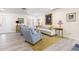 Inviting living room showcasing hardwood floors, neutral paint, light blue accent chairs, and lots of light at 743 43Rd Ne Ave, St Petersburg, FL 33703