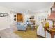 Inviting living room showcasing hardwood floors, neutral paint, light blue accent chairs, and lots of light at 743 43Rd Ne Ave, St Petersburg, FL 33703