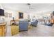 Bright living room with hardwood floors, neutral furniture, and an open concept to the dining area and kitchen at 743 43Rd Ne Ave, St Petersburg, FL 33703