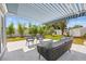 Covered patio with lounge and chairs provides an outdoor living space at 743 43Rd Ne Ave, St Petersburg, FL 33703