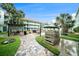 Exterior features outdoor seating in the lush landscaped courtyard at 801 83Rd N Ave # 107, St Petersburg, FL 33702