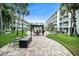 Exterior view of a lush courtyard with seating and landscaping throughout at 801 83Rd N Ave # 107, St Petersburg, FL 33702