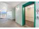 Hallway view featuring elevator with green doors to each level at 801 83Rd N Ave # 107, St Petersburg, FL 33702