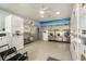 Clean laundry room with beach themed decor featuring multiple machines for residents at 801 83Rd N Ave # 107, St Petersburg, FL 33702