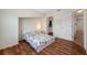 Bedroom featuring hardwood floors, a built-in closet, and plenty of natural light at 8980 Antigua Dr, Seminole, FL 33777