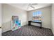 Bedroom featuring a large window with natural light, ceiling fan, and wall shelving at 8980 Antigua Dr, Seminole, FL 33777
