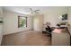 Bedroom with a built-in wardrobe, a built-in desk, wood floors, and natural light through the window at 8980 Antigua Dr, Seminole, FL 33777