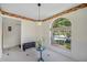 Cozy dining area featuring a large window and a casual bench at 8980 Antigua Dr, Seminole, FL 33777