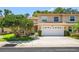 Charming townhouse featuring a two-car garage and well-maintained landscaping at 8980 Antigua Dr, Seminole, FL 33777