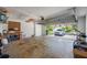 Spacious two-car garage with an open garage door, a car and a bicycle at 8980 Antigua Dr, Seminole, FL 33777