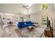 Bright living room with high ceilings, clerestory windows, tile flooring, and comfortable seating at 8980 Antigua Dr, Seminole, FL 33777