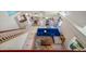 Aerial view of open floor plan living room with vaulted ceilings and view to patio at 8980 Antigua Dr, Seminole, FL 33777