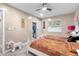 Cozy bedroom featuring two beds, white furniture and a ceiling fan, plus a closet at 9047 Quail Creek Dr, Tampa, FL 33647