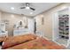 Cozy bedroom featuring two beds, white furniture and a ceiling fan, plus a closet at 9047 Quail Creek Dr, Tampa, FL 33647