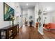 Inviting entryway boasting rich wood floors and stylish decor, seamlessly connecting living spaces at 9047 Quail Creek Dr, Tampa, FL 33647