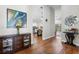 Spacious entryway showcasing hardwood floors, leading to a bright kitchen and open living areas at 9047 Quail Creek Dr, Tampa, FL 33647