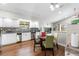 Bright kitchen features white cabinetry, stainless steel appliances, and a cozy dining area at 9047 Quail Creek Dr, Tampa, FL 33647