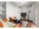 Spacious living room features hardwood floors, a modern TV, and comfortable seating at 9047 Quail Creek Dr, Tampa, FL 33647