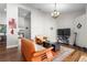 Bright living room featuring hardwood floors, a modern sofa, and ample space for relaxation at 9047 Quail Creek Dr, Tampa, FL 33647