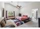 Spacious main bedroom featuring high ceilings, plush carpeting, and a cozy seating area at 9047 Quail Creek Dr, Tampa, FL 33647