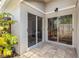 Outdoor patio featuring sliding glass doors to the home's interior at 9047 Quail Creek Dr, Tampa, FL 33647