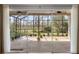 An outdoor screened patio for relaxing and entertaining, with scenic backyard views at 9047 Quail Creek Dr, Tampa, FL 33647