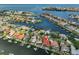 Aerial view highlighting the waterfront property with private dock and the surrounding community at 920 Symphony Isles Blvd, Apollo Beach, FL 33572