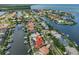 Stunning aerial perspective of a waterfront community, showcasing luxurious homes and boating access at 920 Symphony Isles Blvd, Apollo Beach, FL 33572