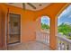 Balcony with decorative columns offering neighborhood views at 920 Symphony Isles Blvd, Apollo Beach, FL 33572