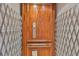 Interior home elevator with wooden door and safety gate at 920 Symphony Isles Blvd, Apollo Beach, FL 33572
