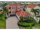 Beautiful Mediterranean style home with a tile roof, two-car garage, and well-manicured landscaping at 920 Symphony Isles Blvd, Apollo Beach, FL 33572