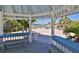 Charming gazebo offering scenic views of the waterfront and surrounding palm trees at 920 Symphony Isles Blvd, Apollo Beach, FL 33572