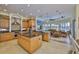 Gourmet kitchen featuring a large center island, stainless steel appliances, and an adjacent seating area at 920 Symphony Isles Blvd, Apollo Beach, FL 33572