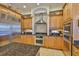 Gourmet kitchen with stainless steel appliances, stone countertops, and abundant storage at 920 Symphony Isles Blvd, Apollo Beach, FL 33572