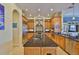 This kitchen boasts stainless steel appliances, granite countertops, and custom cabinets at 920 Symphony Isles Blvd, Apollo Beach, FL 33572