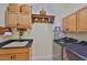 Laundry room featuring cabinetry, counter space, and modern appliances at 920 Symphony Isles Blvd, Apollo Beach, FL 33572