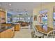Open floor plan with kitchen, dining nook, and living room with great natural light at 920 Symphony Isles Blvd, Apollo Beach, FL 33572