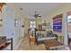 Relaxing living room with a cozy sofa and a ceiling fan at 920 Symphony Isles Blvd, Apollo Beach, FL 33572