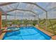 Inviting screened-in pool and spa overlooking the waterfront views at 920 Symphony Isles Blvd, Apollo Beach, FL 33572