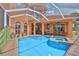 Beautiful screened-in pool and spa area with outdoor seating and plenty of space for entertaining at 920 Symphony Isles Blvd, Apollo Beach, FL 33572