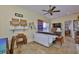 Versatile room with a sewing table, storage shelves and tile floors at 920 Symphony Isles Blvd, Apollo Beach, FL 33572
