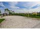 Outdoor sand volleyball court with palm trees and a beautiful view at 920 Symphony Isles Blvd, Apollo Beach, FL 33572