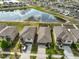 An aerial view of the neighborhood and home, which backs up to a scenic retention pond at 9423 Lemon Drop Loop, Sun City Center, FL 33573
