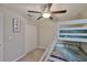 Bedroom featuring a bunk bed, closet and ceiling fan at 9423 Lemon Drop Loop, Sun City Center, FL 33573