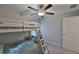 Bedroom with a bunk bed and a view of the window with natural light at 9423 Lemon Drop Loop, Sun City Center, FL 33573
