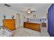 Cozy bedroom featuring ceiling fan, wooden furniture, and comfortable bedding at 9423 Lemon Drop Loop, Sun City Center, FL 33573