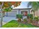 Inviting single-Gathering home with a well-kept lawn and a charming front porch at 9423 Lemon Drop Loop, Sun City Center, FL 33573
