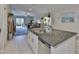 Modern kitchen island with a sink and ample counter space, perfect for meal preparation at 9423 Lemon Drop Loop, Sun City Center, FL 33573